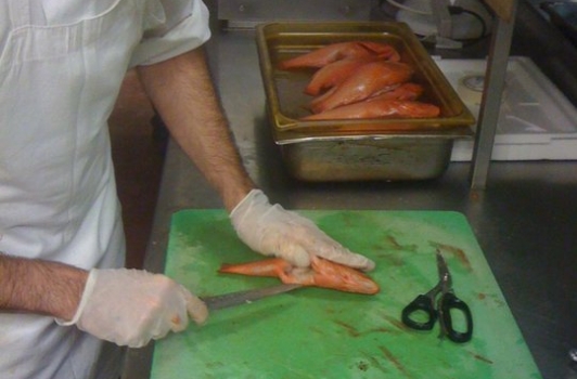 Sous Chef George prepping our special Strawberry Grouper 